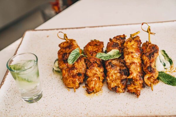 Grilled chicken skewers with mint sauce at Naxaki Beach Lounge & Restaurant in Naxos