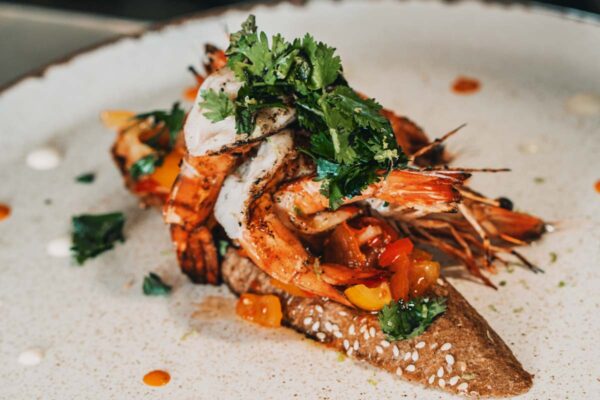 Grilled shrimp served on sesame bread with fresh herbs at Naxaki Beach Lounge & Restaurant in Naxos