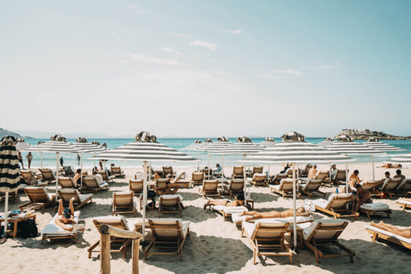 Beachfront view from Naxaki Beach Lounge Restaurant with sunbeds and umbrellas