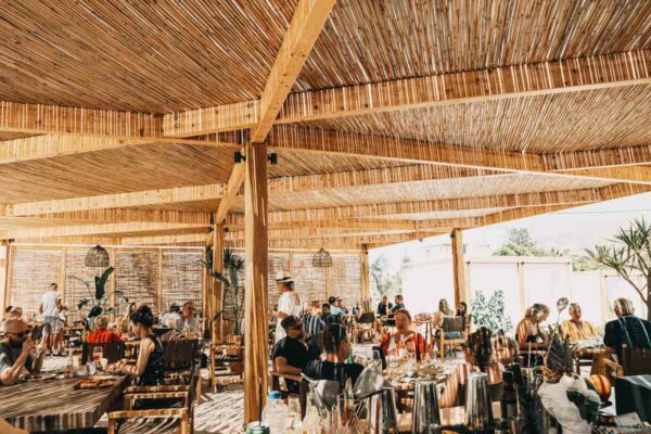 Dining area at Naxaki beach lounge restaurant with bamboo ceiling