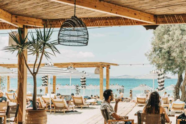 Dining area with a view of the beach at Naxaki Beach Lounge Restaurant