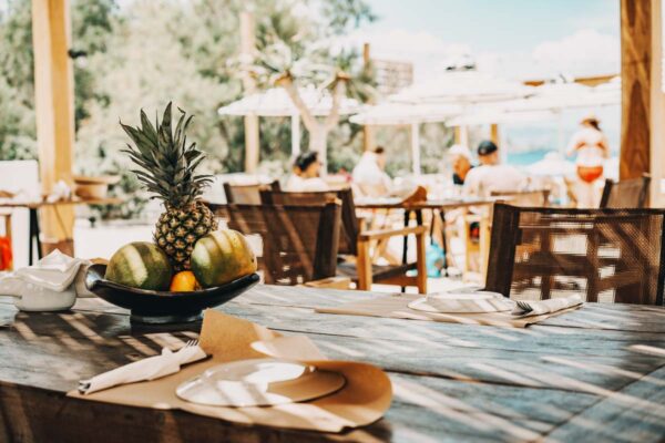 Table set with fruit decor at Naxaki beach lounge restaurant