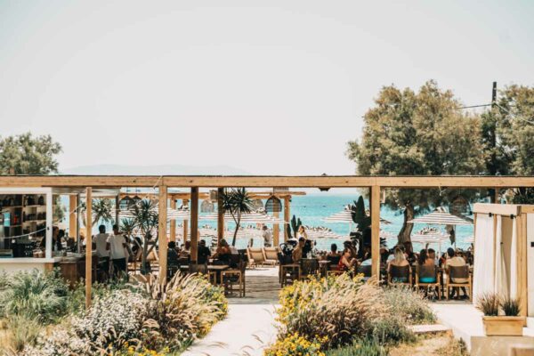 Seaside view of Naxaki Beach Lounge Restaurant with dining guests