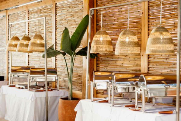 Wedding buffet area setup with elegant lighting at Naxaki Beach Lounge