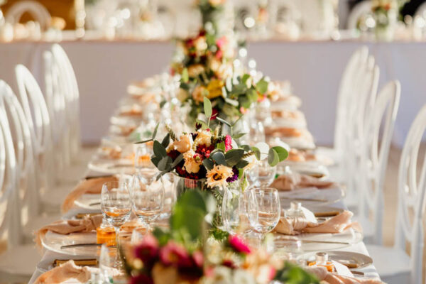 Elegant floral table setting for a wedding at Naxaki Beach Lounge and Restaurant